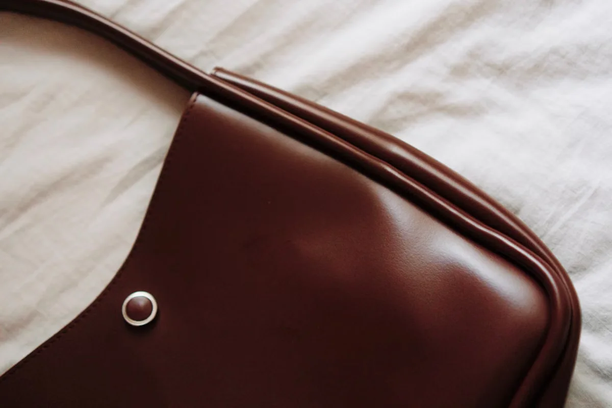 Detail of a structured leather tote bag — import duties on leather handbags from China are assessed on the declared customs value of the goods, making accurate product valuation a critical part of landed cost planning