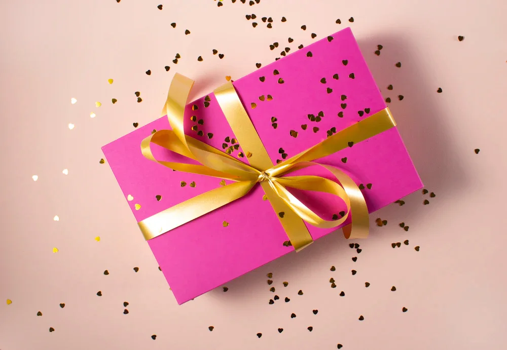 Luxury rigid gift box with magnetic closure, opening to reveal a handbag in tissue paper